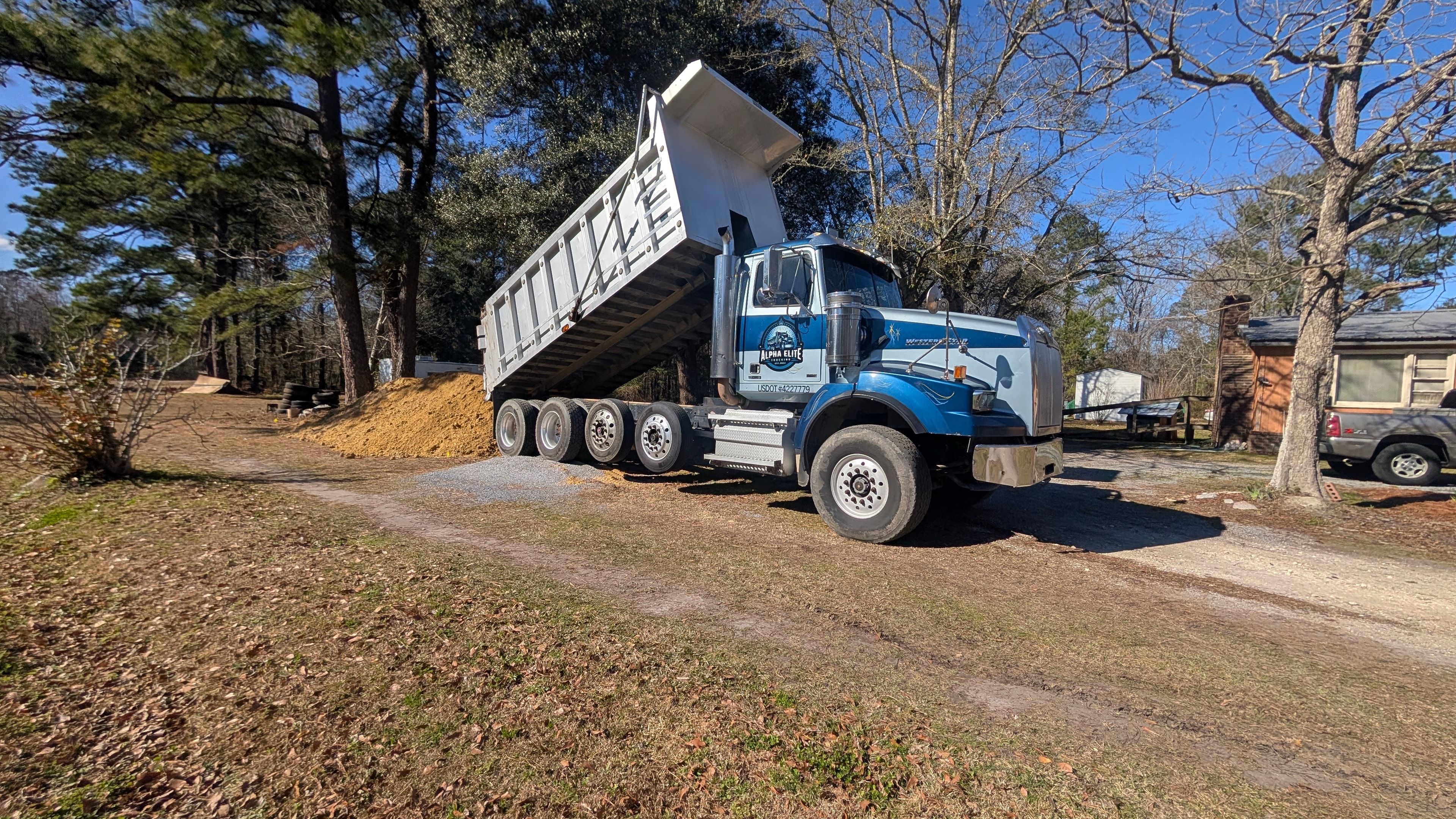 Dump truck hauling gravel at a quarry