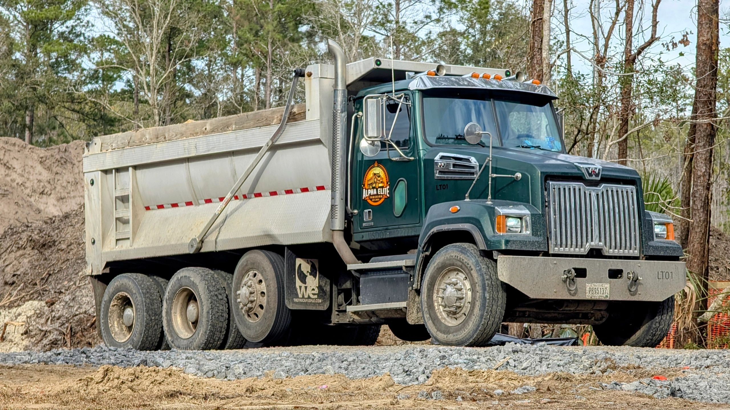 Alpha Elite dump truck at gravel site